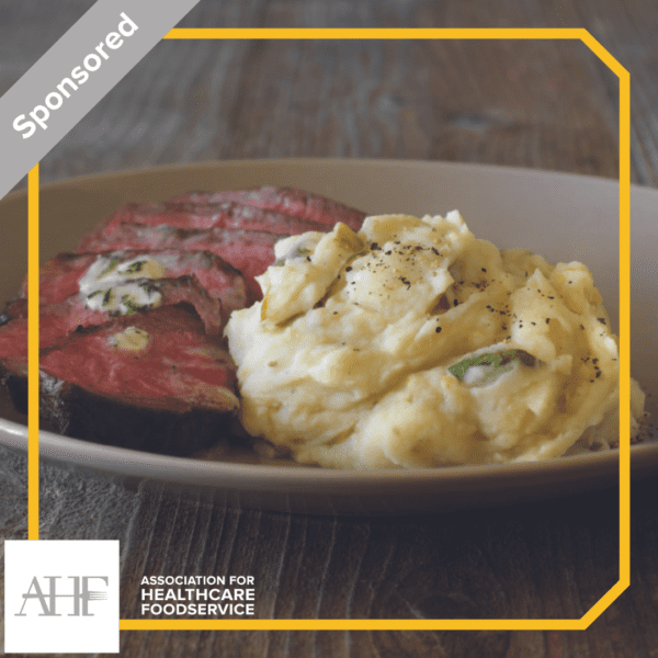 Mashed potatoes and steak on white plate labeled "sponsored" with AHF label.