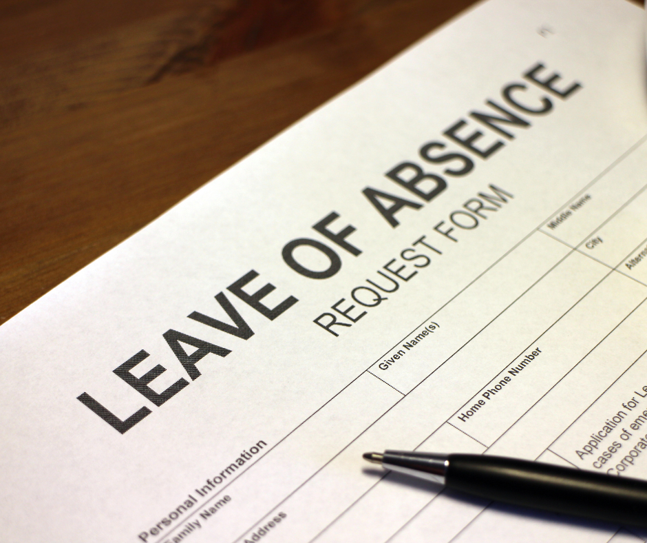 blank leave of absence form on desk with pen.